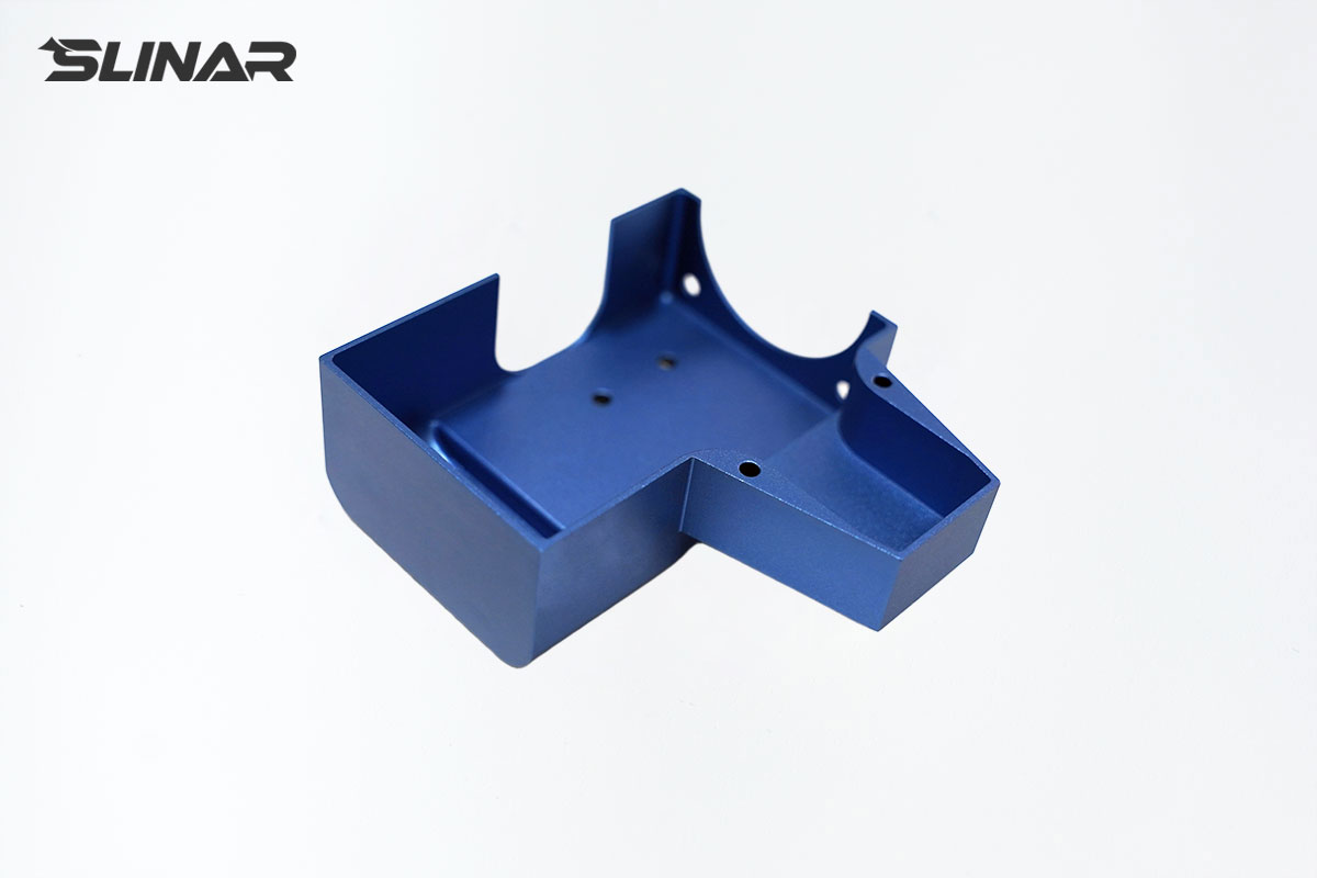 6061 aluminum unibody custom-shaped cavity housing with blue anodized finish and seamless construction