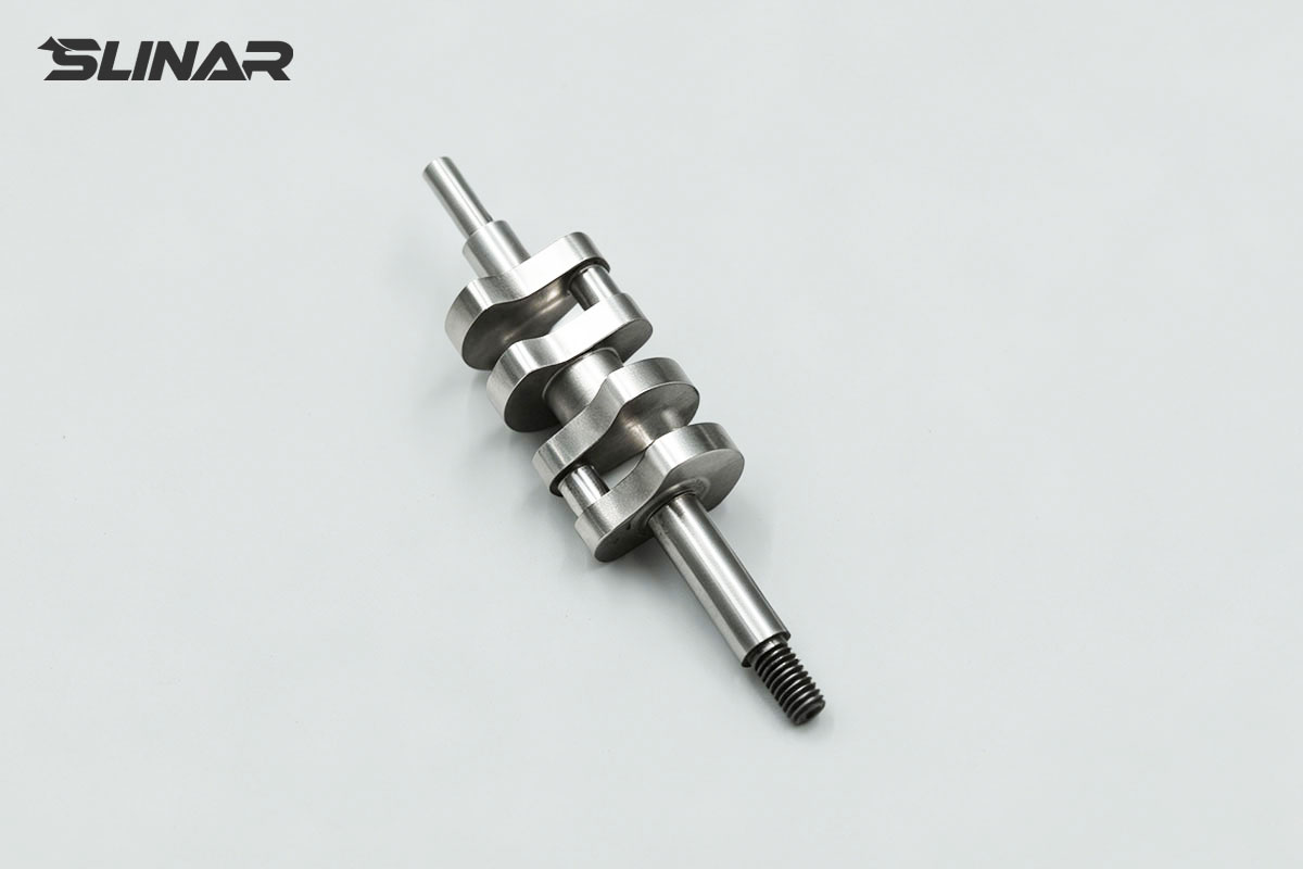 Tool steel micro multi-throw crankshaft with three integrated crank throws for synchronized reciprocating motion
