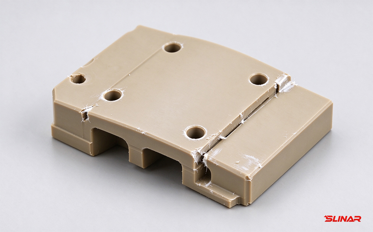 Typical burr, whitening, and melt residue on a PEEK milled surface